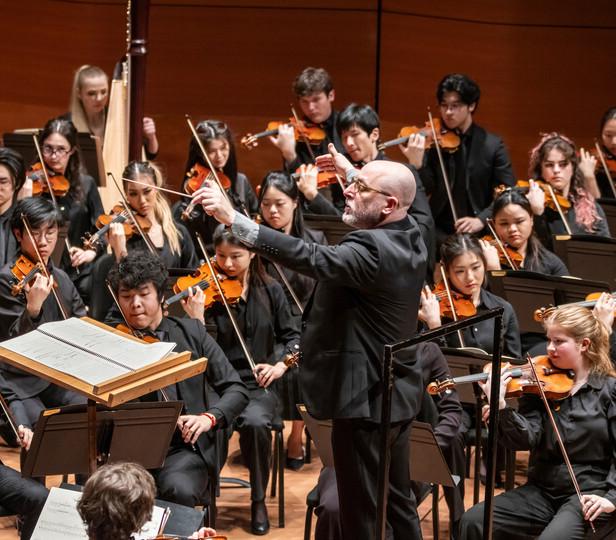 conductor leads an orchestra